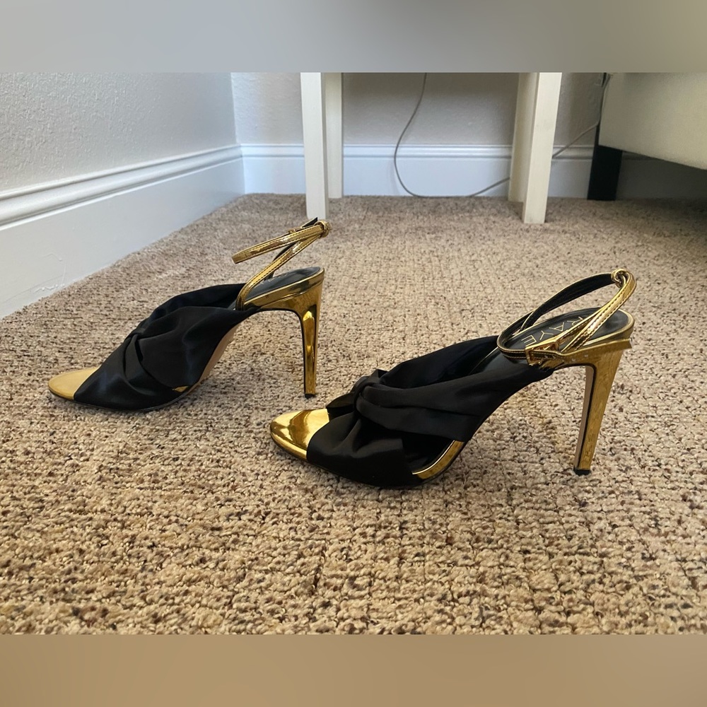 Raye Grace heels. Size 8.5. Never worn. Shiny Gold & black satin.